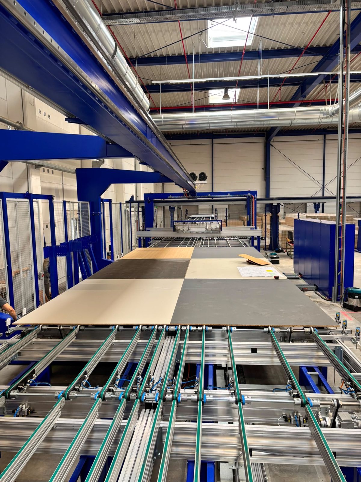 Production hall with the panel handling line beneath the mezzanine floor — Ballerina-Küchen, Rödinghausen