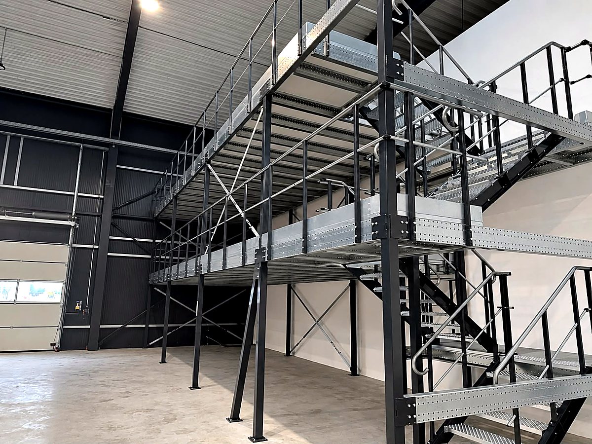 Completed steel mezzanine with access staircase and railings — Yido Wheels GmbH, Wedemark