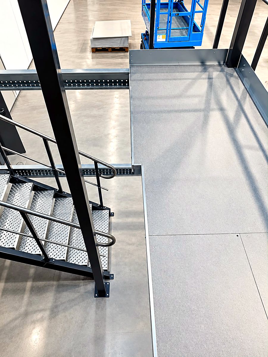 Staircase with grating steps and mezzanine decking from above — Yido Wheels GmbH, Wedemark